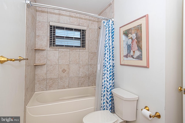 bathroom with shower / tub combo and toilet