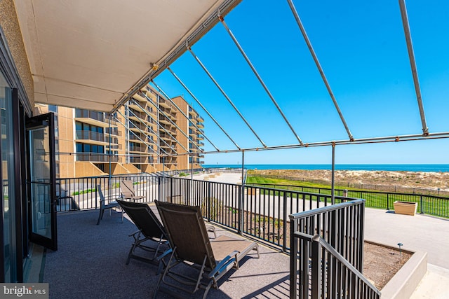 balcony featuring a water view