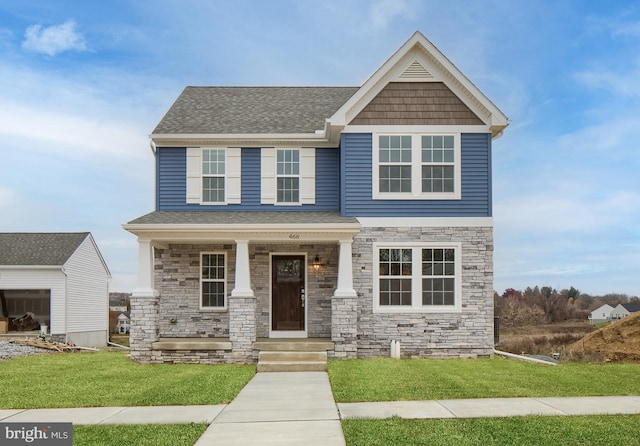 craftsman-style house with a porch, a front yard, stone siding, and a shingled roof