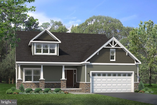 craftsman house with a porch, a front yard, and a garage