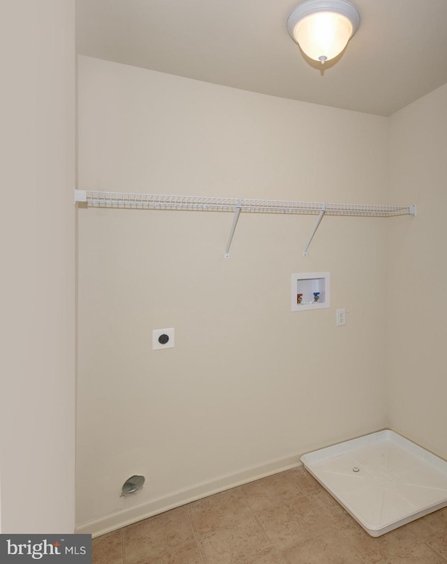 clothes washing area featuring light tile floors, hookup for an electric dryer, and washer hookup