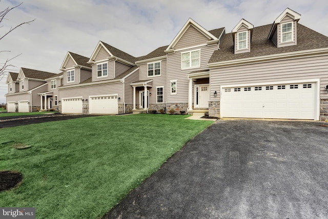 view of front facade featuring a front lawn and a garage