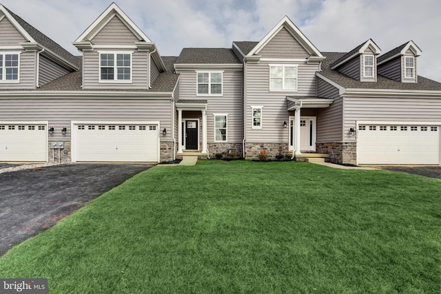 view of front of house with a front lawn and a garage