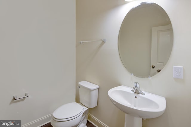 bathroom with toilet and sink