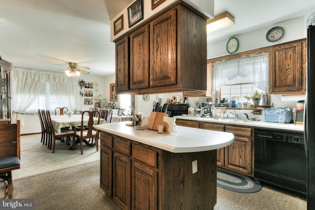 kitchen featuring light colored carpet, dark brown cabinetry, black dishwasher, and ceiling fan