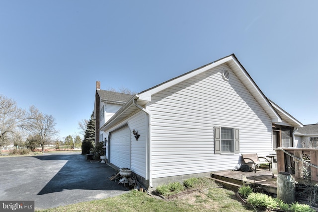 view of home's exterior featuring a deck