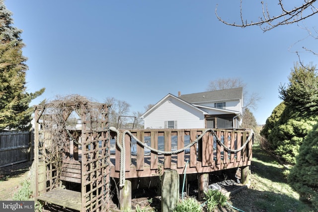 rear view of house with a wooden deck