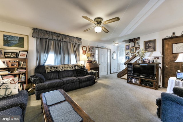 carpeted living room featuring ceiling fan