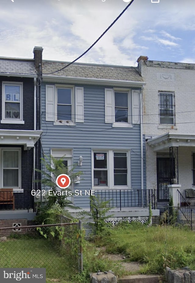 townhome / multi-family property with covered porch