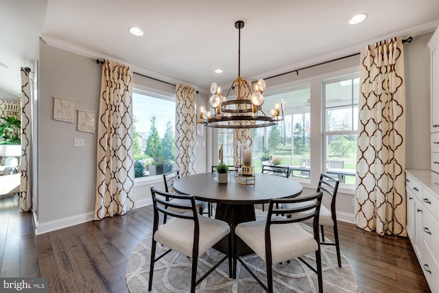 dining space with a healthy amount of sunlight, dark wood-type flooring, and a notable chandelier