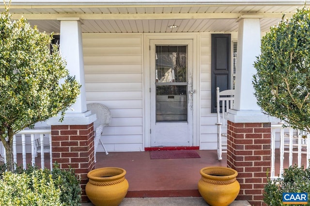 entrance to property featuring covered porch