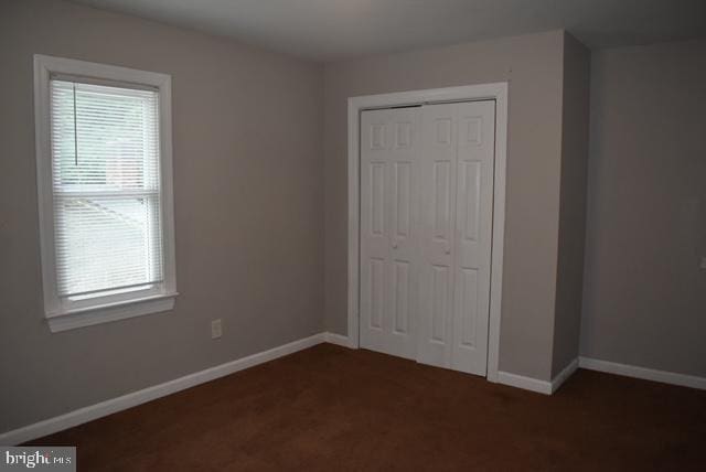 unfurnished bedroom with a closet