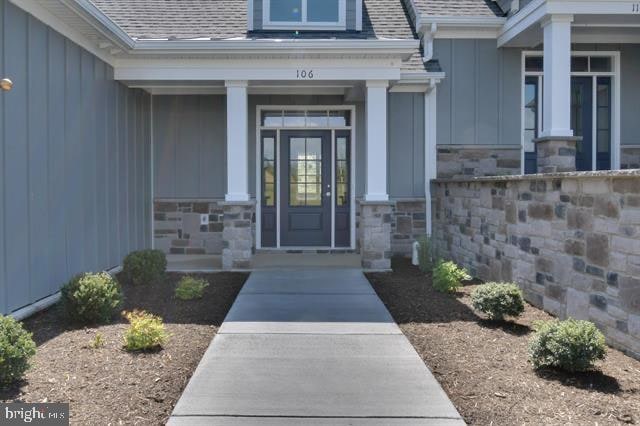 view of exterior entry with a porch