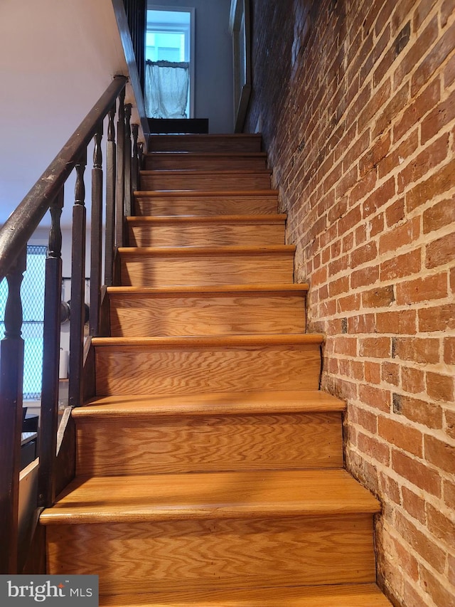 stairs with brick wall