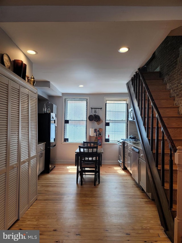 unfurnished dining area with light hardwood / wood-style flooring