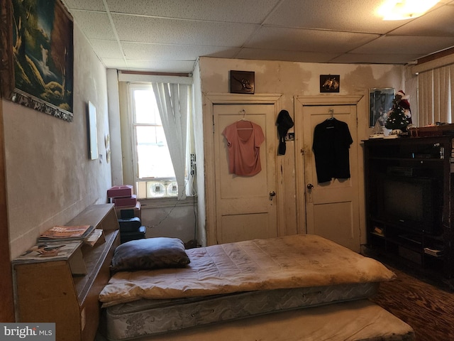 bedroom with a paneled ceiling