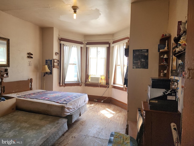 bedroom featuring ceiling fan and hardwood / wood-style floors