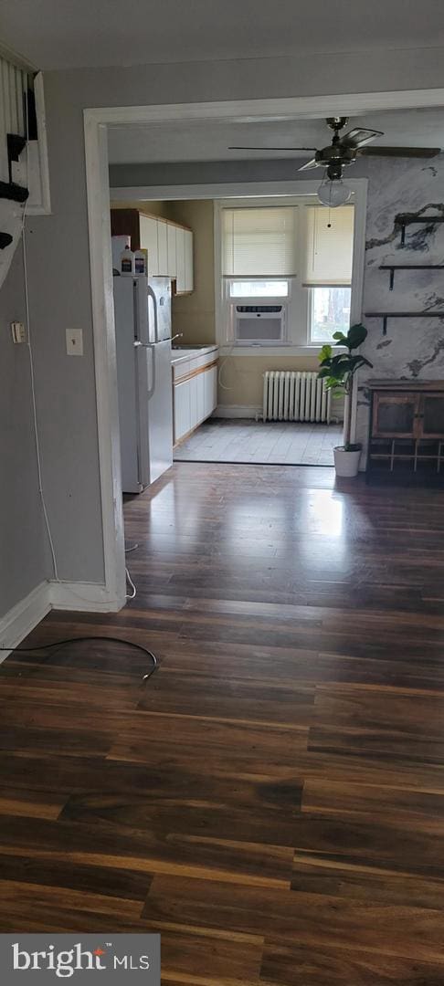 interior space featuring radiator and dark wood-type flooring