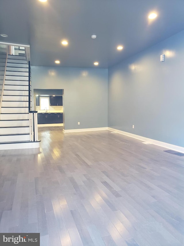 spare room featuring dark hardwood / wood-style flooring