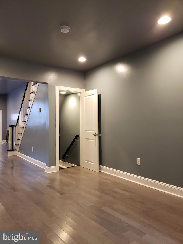 empty room featuring dark hardwood / wood-style flooring