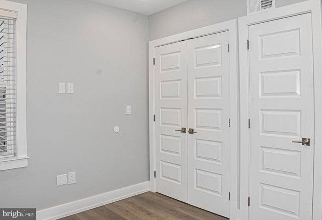 interior space with dark wood-type flooring