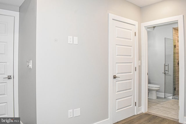 corridor with dark wood-type flooring