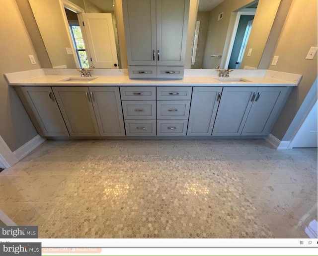 bathroom with dual vanity and tile floors