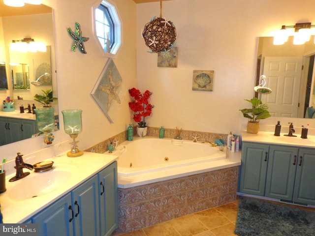 bathroom with tile flooring, tiled bath, and double vanity