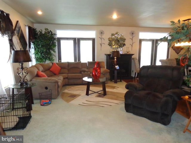 living room with french doors and light colored carpet