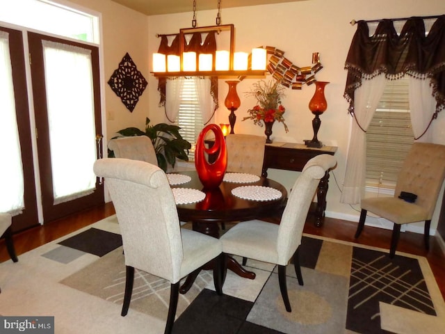 dining area with dark hardwood / wood-style flooring