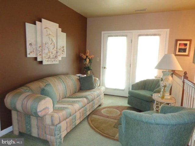 carpeted living room featuring a wealth of natural light