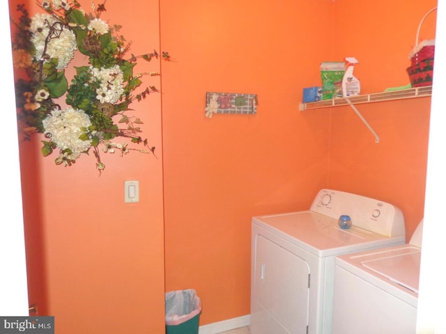 laundry area with independent washer and dryer