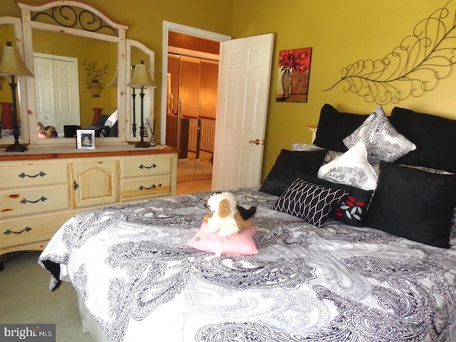 bedroom featuring tile floors and a closet