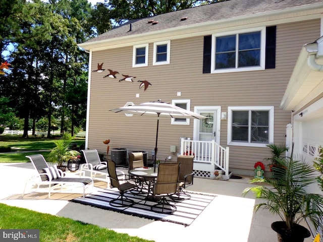 rear view of property featuring a patio