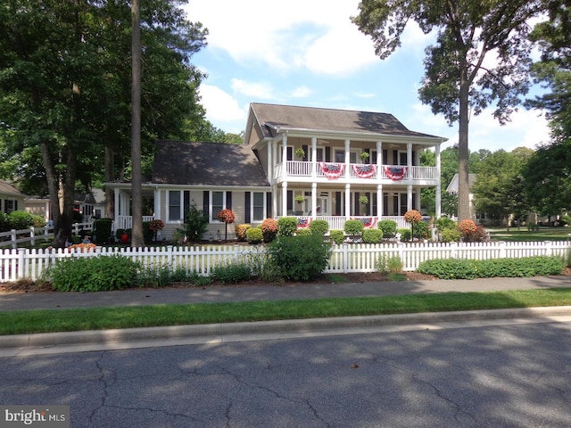 view of front of house featuring a balcony