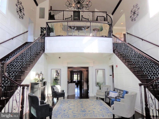 interior space featuring an inviting chandelier and a high ceiling