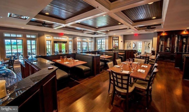 dining space featuring ceiling fan, coffered ceiling, dark hardwood / wood-style flooring, and french doors