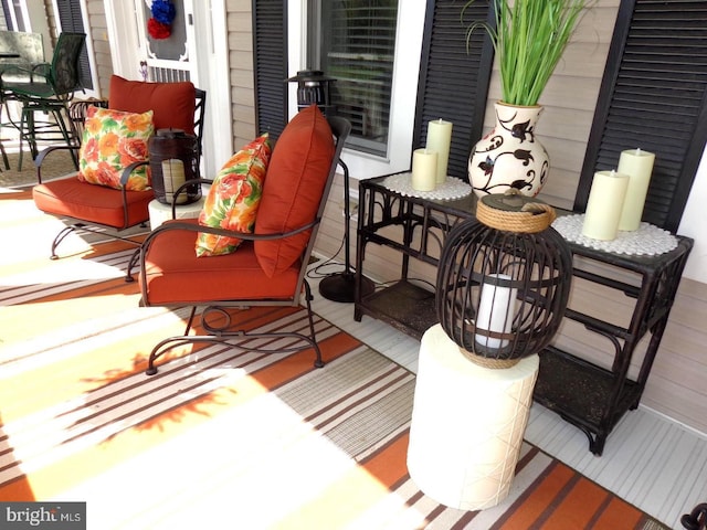 wooden terrace with an outdoor hangout area