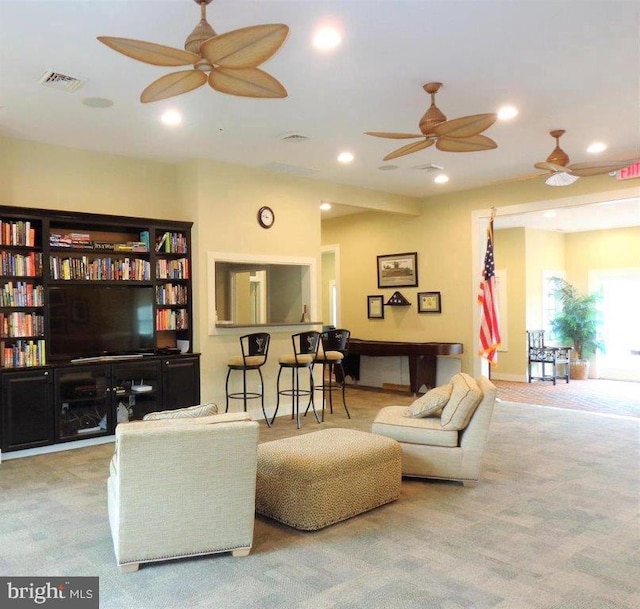 living room with ceiling fan and light carpet