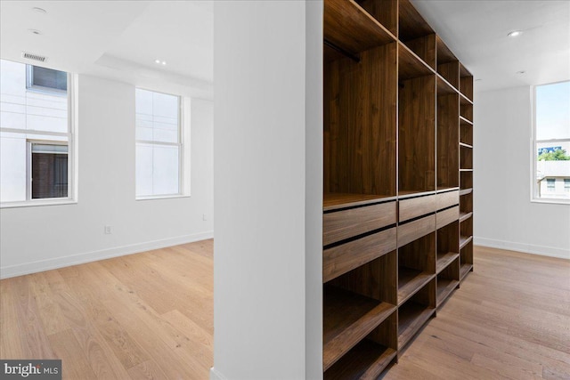 walk in closet featuring light wood-type flooring