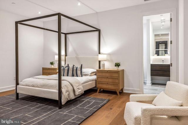 bedroom featuring hardwood / wood-style flooring