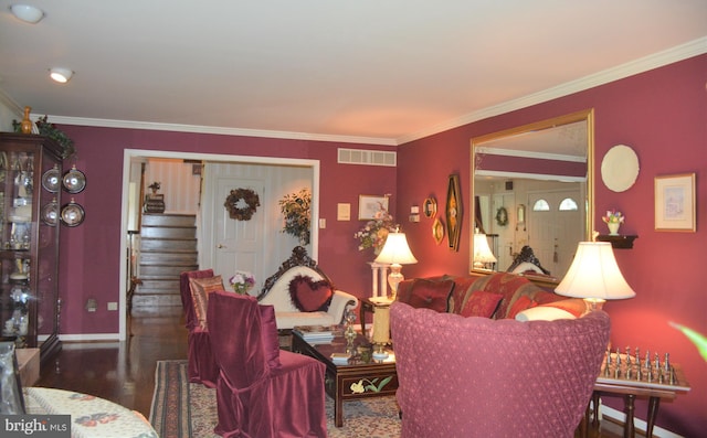 living room featuring dark hardwood / wood-style floors and ornamental molding