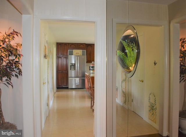 corridor featuring light tile floors