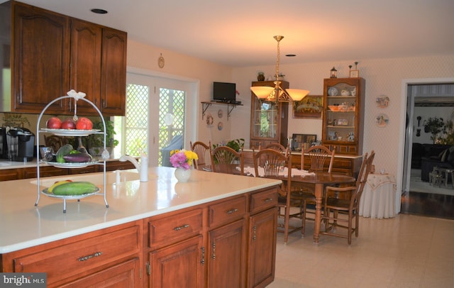 kitchen with light tile floors and pendant lighting