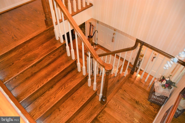 stairway with dark wood-type flooring