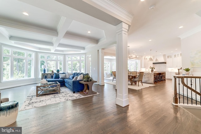 living room with dark hardwood / wood-style flooring, coffered ceiling, beamed ceiling, crown molding, and decorative columns