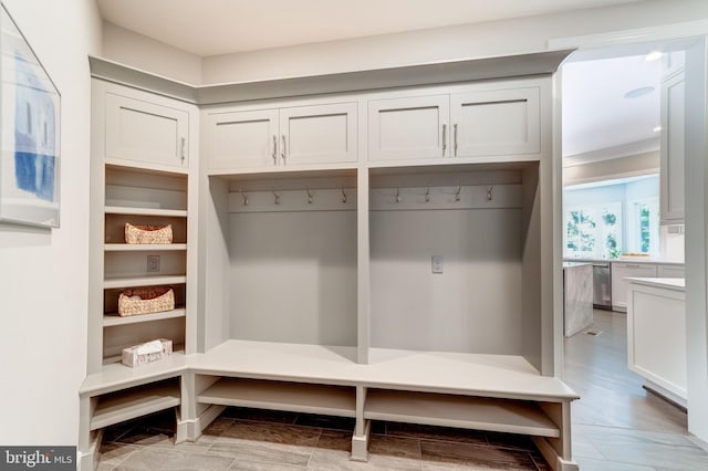 mudroom with light hardwood / wood-style floors