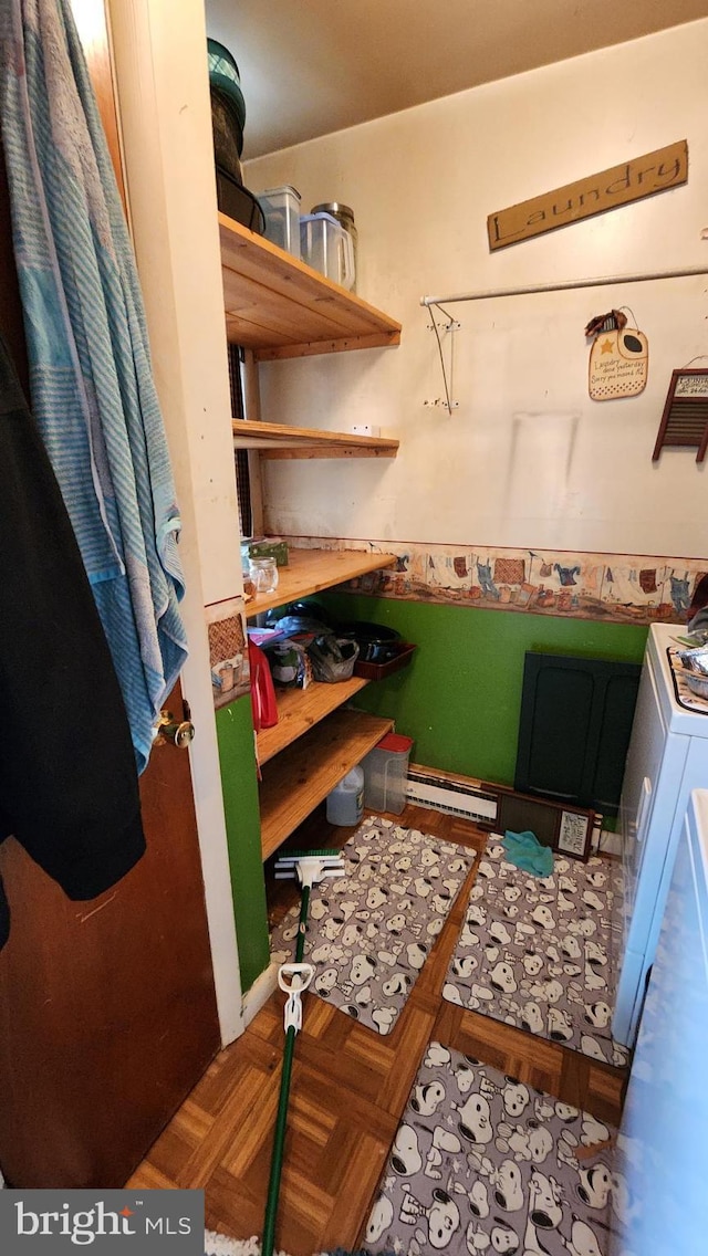 interior space featuring parquet floors and washer / clothes dryer