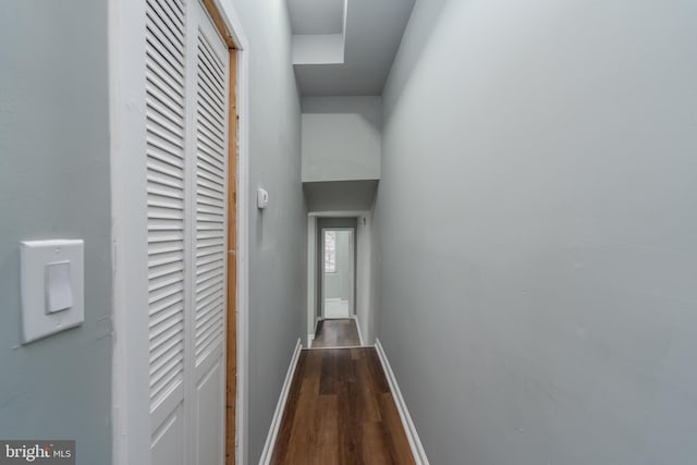 corridor featuring dark hardwood / wood-style floors