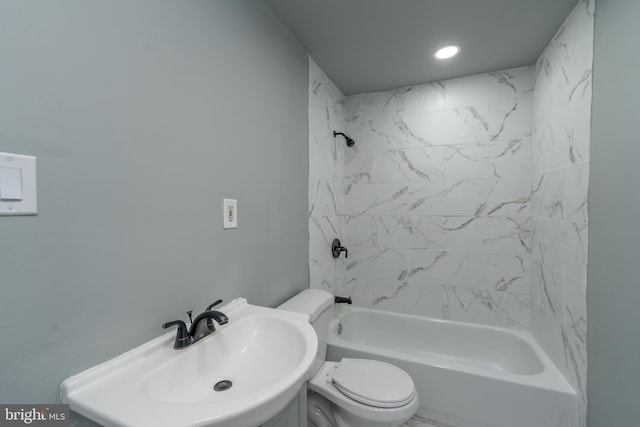 full bathroom featuring sink, toilet, and tiled shower / bath combo